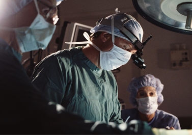 A group of doctors and nurses perform surgery in an operating room A group of doctors perform surgery - Doctor Mosaraf Ali